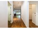 Hallway with wood-look floors leading to the main living areas at 2008 Berry Lake Dr, Brandon, FL 33510