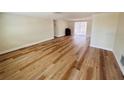 Bright and spacious living room featuring new wood floors and sliding glass doors to the pool at 6046 7Th Ave, New Port Richey, FL 34653