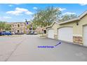 View of detached garage with white door at 10203 Courtney Palms Blvd # 301, Tampa, FL 33619