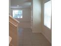 Bright entryway with tile flooring and a view into the adjacent living area at 10928 Carlton Fields Dr, Riverview, FL 33579