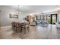 Open-concept living space with dining area, comfortable seating, and large windows offering natural light at 199 Dali Blvd # 403, St Petersburg, FL 33701