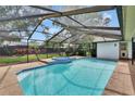 Screened pool with jacuzzi and textured concrete deck offers a relaxing outdoor living space at 2413 Buckhorn Run Dr, Valrico, FL 33596
