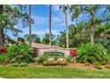 The Reserve community entrance sign surrounded by lush landscaping and tall trees against a blue sky at 2823 Banyan Hill Ln, Land O Lakes, FL 34639