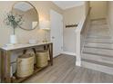 Entryway with ceramic tile floors, console table, staircase, and neutral paint colors at 4139 Rocky Shores Dr, Tampa, FL 33634