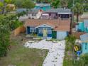 Charming single-story home featuring a driveway, fenced yard, and inviting curb appeal at 4727 17Th S Ave, St Petersburg, FL 33711