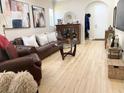 Comfortable living room with a leather sofa, hardwood floors, and tasteful artwork at 514 S Orleans Ave # 4, Tampa, FL 33606