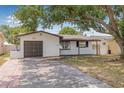 Charming single-story home with a well-maintained front yard and a one-car garage at 5734 20Th N Ave, St Petersburg, FL 33710