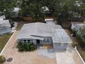 Aerial view of a gray single-story home with gravel landscaping and a partially shaded lot at 6710 Hibiscus S Ave, South Pasadena, FL 33707