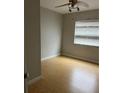 Standard bedroom includes laminate flooring, ceiling fan, and ample natural light at 7210 N Manhattan Ave # 1311, Tampa, FL 33614