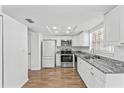 Bright kitchen boasts stainless steel appliances, granite countertops, and ample cabinet space at 7627 Deleon Ct, Tampa, FL 33615