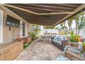 Inviting covered patio with comfortable seating, perfect for outdoor relaxation and entertainment at 7851 120Th St, Seminole, FL 33772