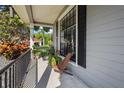 Relaxing front porch provides a comfortable outdoor space with scenic views and a tranquil atmosphere at 8401 Ashford Pl, Trinity, FL 34655
