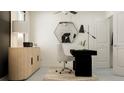 Modern office space with sleek black desk, neutral chair, and stylish decor at 10217 Trumpet Honeysuckle Way, San Antonio, FL 33576