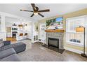 Spacious living room features a brick fireplace and an open layout into the modern kitchen at 1174 8Th N St, St Petersburg, FL 33701