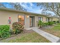 Inviting single story home featuring well-manicured landscaping and a welcoming entrance at 2696 60Th Avenue W Ter # 10, Bradenton, FL 34207
