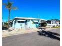 Well-kept mobile home with a convenient carport, adorned with charming details and set in a tidy community at 34483 Cactus N Dr, Pinellas Park, FL 33781