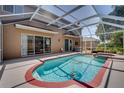 Inviting screened-in pool with spa, perfect for relaxing and entertaining in your own backyard oasis at 4222 Trumpworth Ct, Valrico, FL 33596