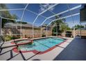 Backyard pool features a screened enclosure, with spa and ample deck space for entertaining and outdoor enjoyment at 4222 Trumpworth Ct, Valrico, FL 33596
