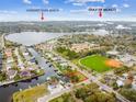 Aerial view of a neighborhood near Howard Park Beach with water access and a baseball field at 600 Banana St, Tarpon Springs, FL 34689