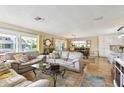 Spacious living room with comfortable seating and plenty of natural light at 616 2Nd St, Indian Rocks Beach, FL 33785