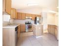 Spacious kitchen with stainless steel appliances, tile flooring, and ample cabinet space at 8812 Beeler Dr, Tampa, FL 33626