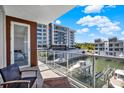 Relaxing balcony with scenic views of the waterway and nearby condos at 920 N Osceola Ave # 301, Clearwater, FL 33755