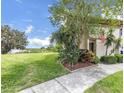 Lovely two-story townhouse boasts lush landscaping and views of nearby lake at 9209 Seminole Blvd # 12, Seminole, FL 33772