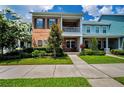 Charming two-story townhome with brick facade, balcony and well manicured lawn at 10035 New Parke Rd, Tampa, FL 33626