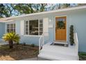Charming front entrance with a wood door and well-maintained landscaping at 1400 23Rd S Ave, St Petersburg, FL 33705