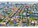 An aerial view of a cozy home nestled in a vibrant neighborhood, close to amenities and city attractions at 17595 1St E St, Redington Shores, FL 33708