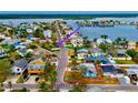 An aerial view of a cozy home near a city park and playground, nestled in a friendly neighborhood at 17595 1St E St, Redington Shores, FL 33708