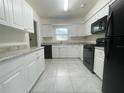 Bright kitchen with white cabinets and modern appliances at 206 Circle Hill Dr, Brandon, FL 33510