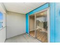 View of condo balcony with sliding glass doors leading to interior showcasing the beautiful wood flooring at 3315 58Th S Ave # 605, St Petersburg, FL 33712