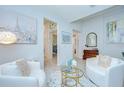 Bright living room featuring modern decor, stylish furniture, and an open layout at 33518 Castaway Loop, Wesley Chapel, FL 33543