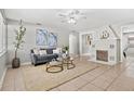 Bright living room boasts a decorative fireplace, neutral paint, and cozy furniture at 5015 15Th S Ave, Gulfport, FL 33707