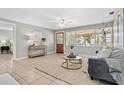 Comfortable living room with large windows, wood door, and stylish furnishings at 5015 15Th S Ave, Gulfport, FL 33707