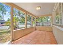 Inviting front porch featuring tile flooring, offering a great place to relax at 5015 15Th S Ave, Gulfport, FL 33707