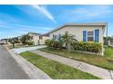 Inviting single-story home with a covered carport, garage, and neatly manicured lawn at 520 Canal Way, Oldsmar, FL 34677