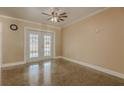 Comfortable living room with tile flooring and glass patio doors at 5803 Cresthill Dr, Tampa, FL 33615