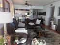 Cozy living room featuring hardwood floors and a large comfortable sofa at 7922 Sailboat Key S Blvd # 608, South Pasadena, FL 33707