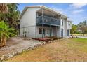 This exterior image shows a private patio area with outdoor seating and lush landscaping at 824 35Th Avenue W Dr, Palmetto, FL 34221