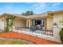 Inviting front porch with outdoor seating, creating a cozy and welcoming entrance at 9114 Dorsey St, Spring Hill, FL 34608