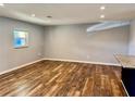 Living room featuring wood floors, recessed lighting, and a window with natural light at 9893 86Th N Way, Seminole, FL 33777