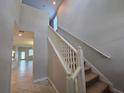 Bright staircase with neutral walls and carpeted steps, leading to the upper level of the home at 1022 Oliveto Verdi Ct, Brandon, FL 33511