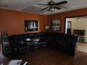 Cozy living room with a large sectional sofa and a view into the kitchen at 1100 Union S St, St Petersburg, FL 33712