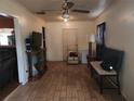 Bright living room features wood flooring, a ceiling fan, and ample natural light at 1100 Union S St, St Petersburg, FL 33712