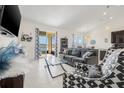 Comfortable living room with sliding doors, modern décor, and plenty of natural light at 11917 Greenchop Pl, Riverview, FL 33579