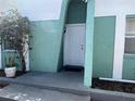 The exterior view shows a modern house with a well-maintained front door and landscaping at 2068 San Marino N Way, Clearwater, FL 33763