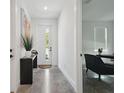 Bright entryway showcasing polished concrete floors, modern console table, and a glimpse into the office space at 2758 5Th S Ave, St Petersburg, FL 33712