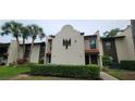 Exterior of a multi-Gathering building with well-maintained landscaping, showcasing its appealing curb appeal and design at 3505 Tarpon Woods Blvd # P408, Palm Harbor, FL 34685